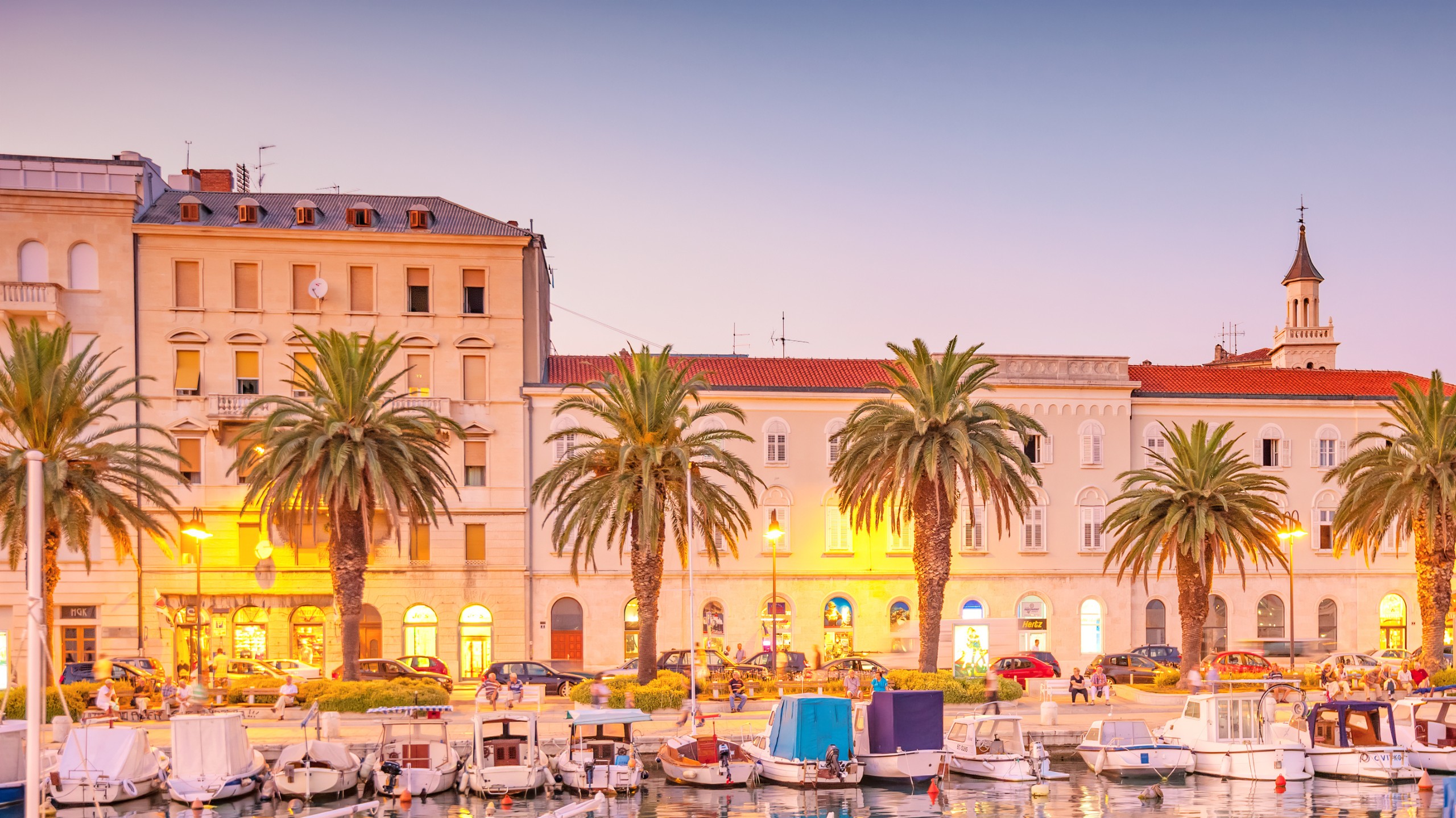 People enjoy the evening on the downtown waterfront in Split, Croatia.